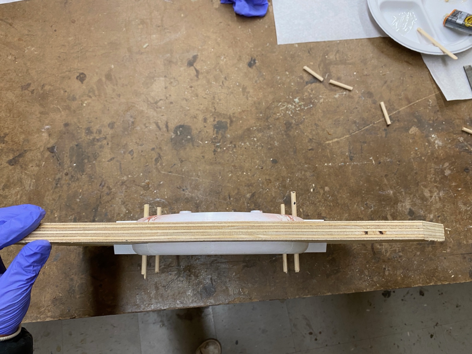 Pattern with sprue and riser dowels installed before sand packing.