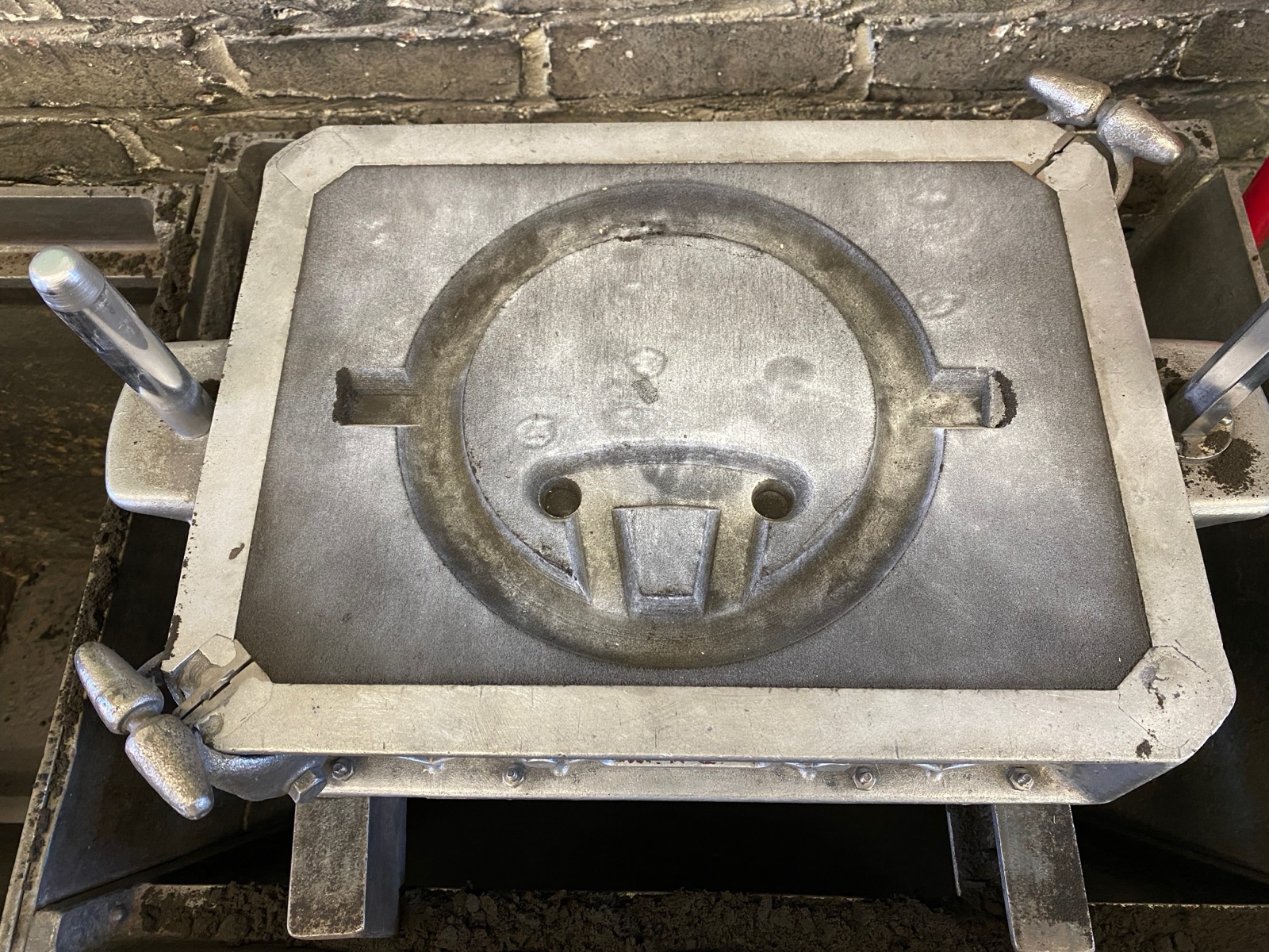 Sand mold cavity after the pattern was removed.