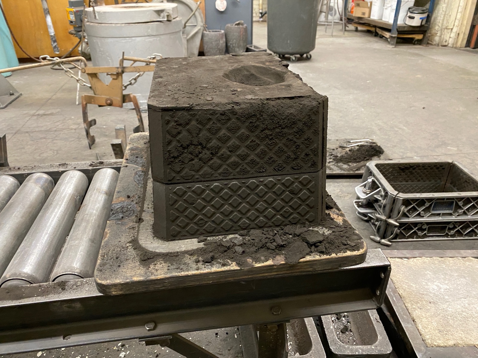 Assembled sand mold — cope on top of drag, clamped together and ready for pour.