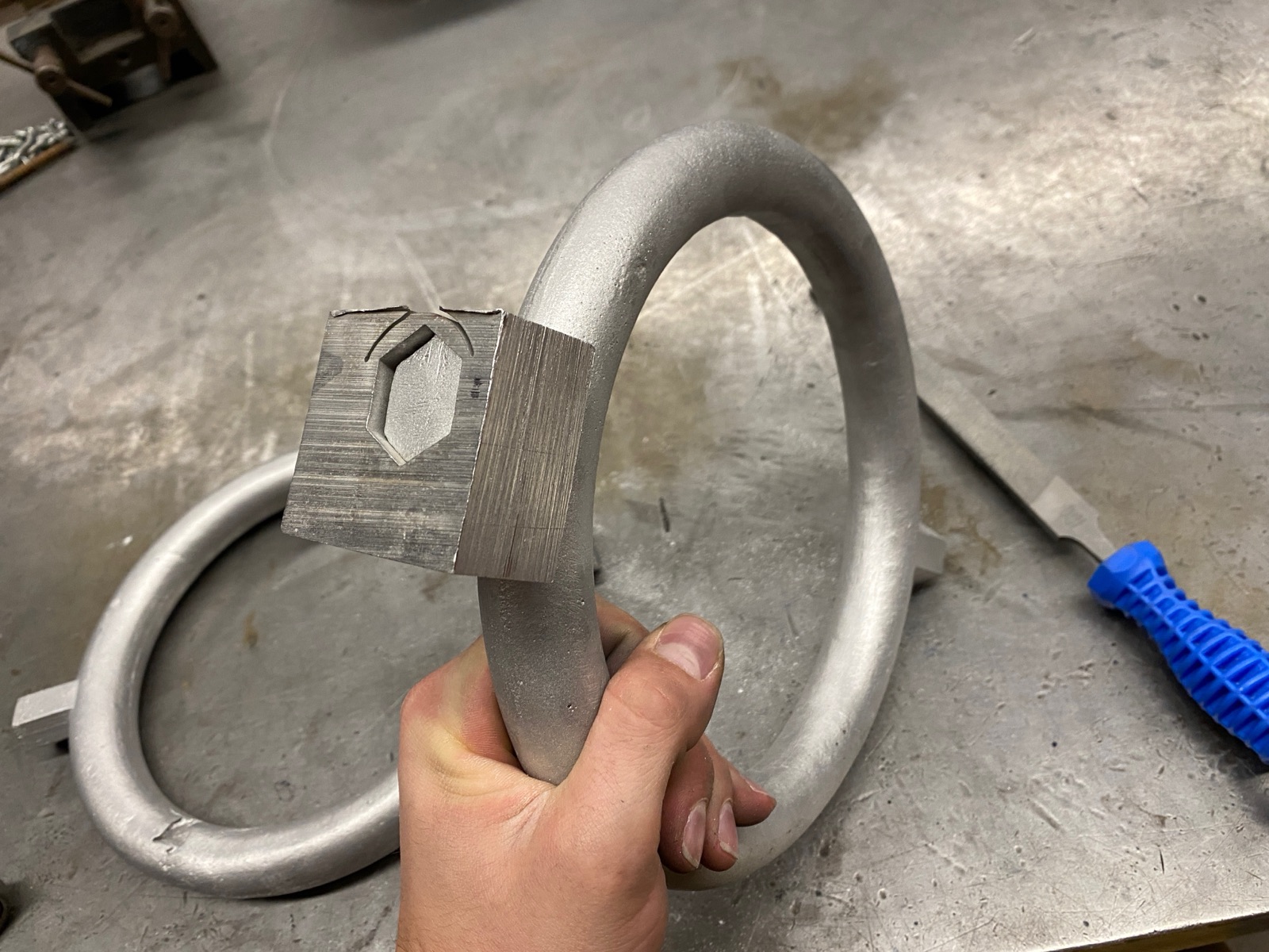 Test block fit-checked onto the cast aluminum ring's hex peg.